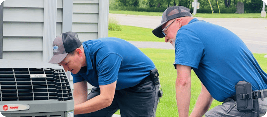 HVAC installation team installing a new Trane heat pump in Okemos, MI.